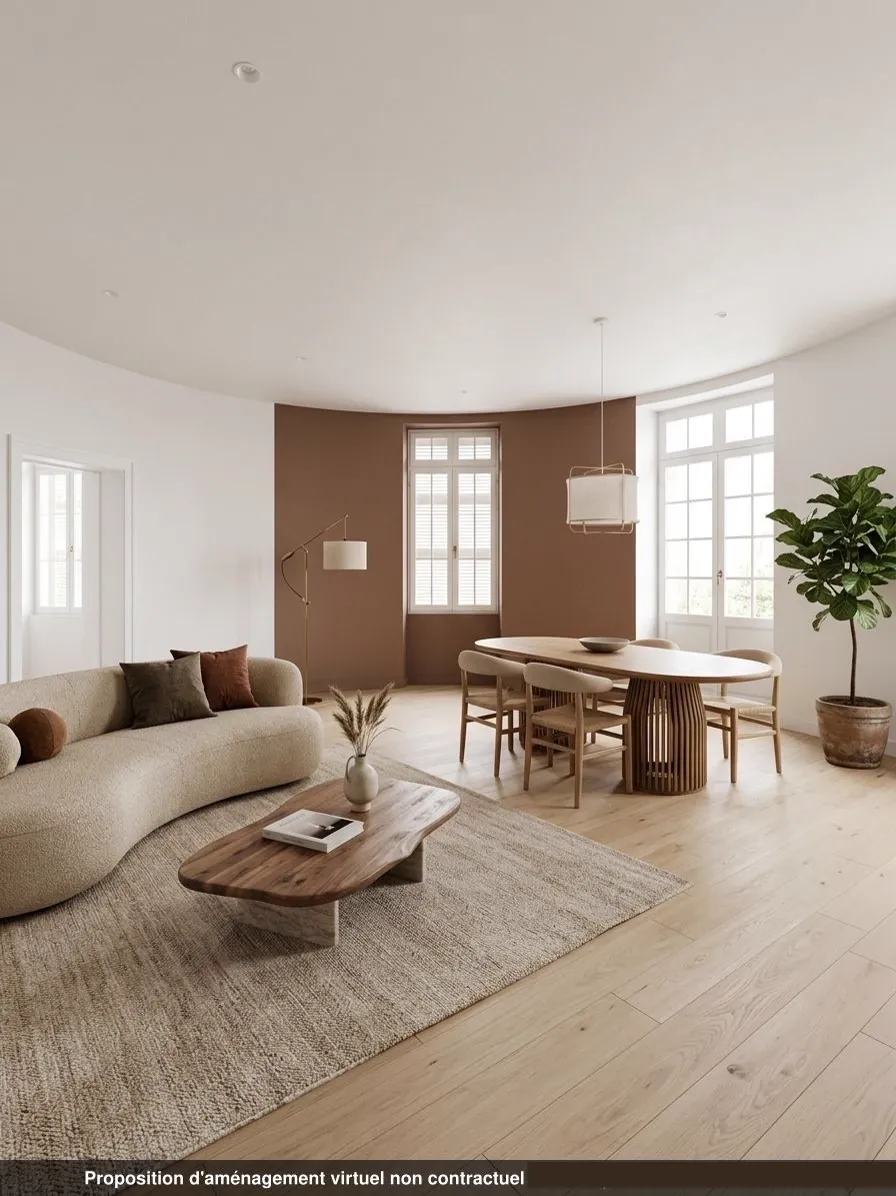 Séjour du lot 1.04 restauré, mur terracotta, parquet de chêne et mobilier contemporain